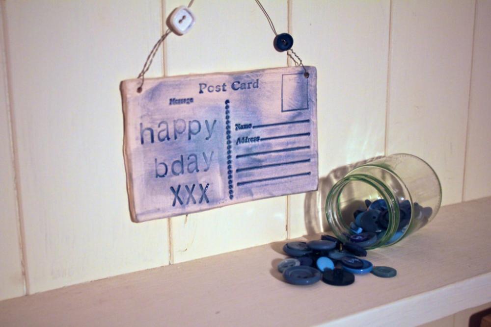 Ceramic Birthday Postcard. Lightly glazed in blue. Handmade made in Wales, UK
