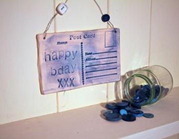 Ceramic Birthday Postcard. Lightly glazed in blue. Handmade made in Wales, UK